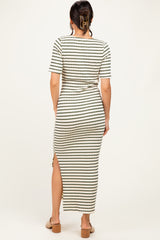 woman wearing a striped maxi dress with short sleeves and a side slit, shown from the back