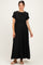 woman wearing a black short sleeve maternity maxi dress with a fitted bodice and flowy skirt, showcasing her baby bump