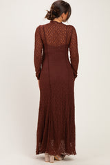 woman wearing a brown long sleeve lace maternity dress seen from the back