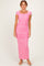 woman wearing a pink ruched maxi dress with short sleeves and a square neckline