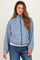 woman wearing a blue checkered maternity jacket with a zipper and front pockets, styled with blue jeans