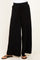 woman wearing black wide-leg sweatpants with an adjustable drawstring waistband and flip-flops
