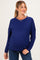 woman wearing a navy blue textured maternity sweater with a relaxed fit and long sleeves, showing a baby bump