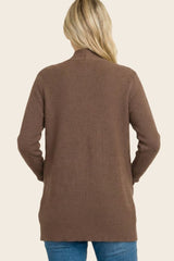 woman wearing a brown ribbed long sleeve cardigan, viewed from the back