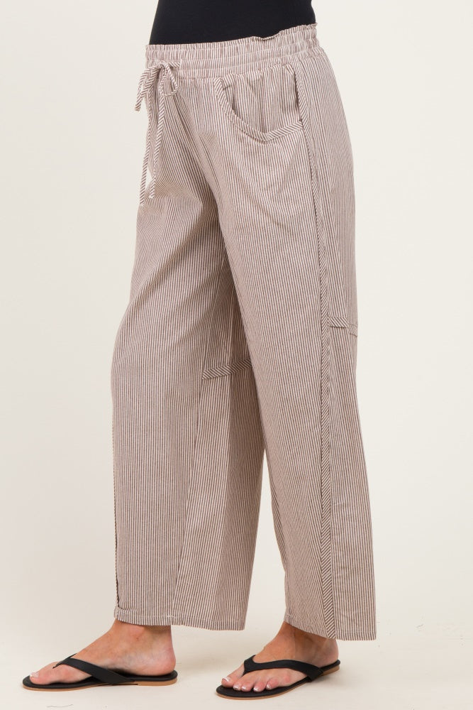 woman wearing striped maternity wide-leg pants with an elastic waistband and side pockets