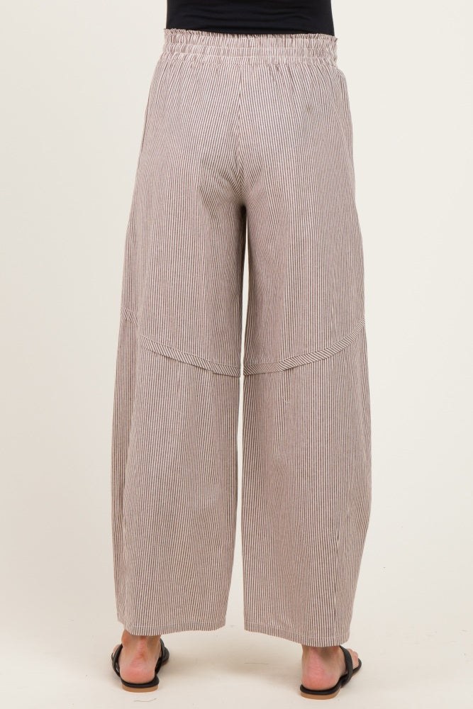 woman wearing striped maternity wide-leg pants with an elastic waistband, seen from the back
