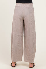 woman wearing striped maternity wide-leg pants with an elastic waistband, seen from the back