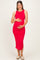 woman wearing a red maternity dress with side ruching and holding her baby bump