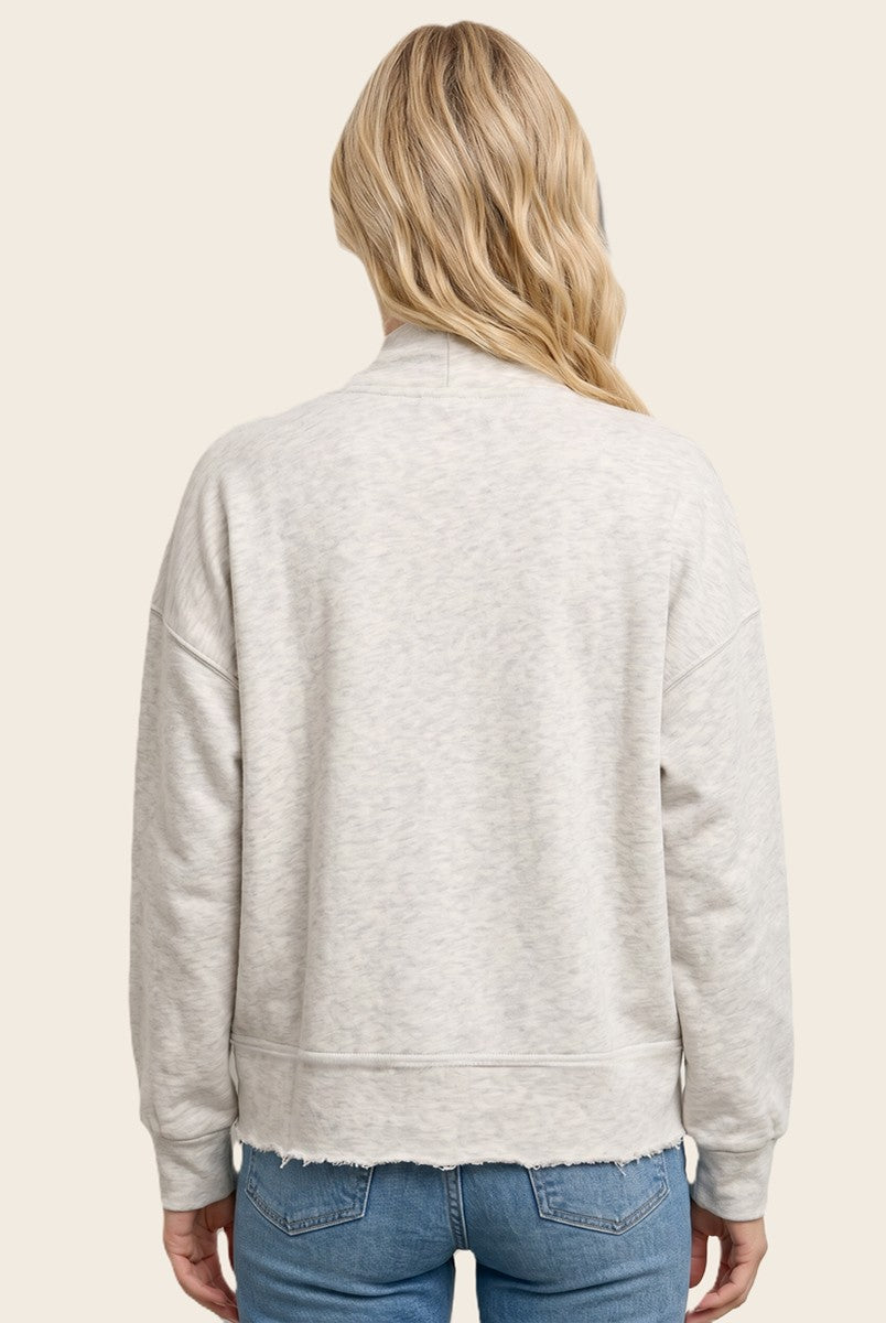 woman wearing a light gray cropped sweatshirt with slouchy shoulders and raw hem, seen from the back