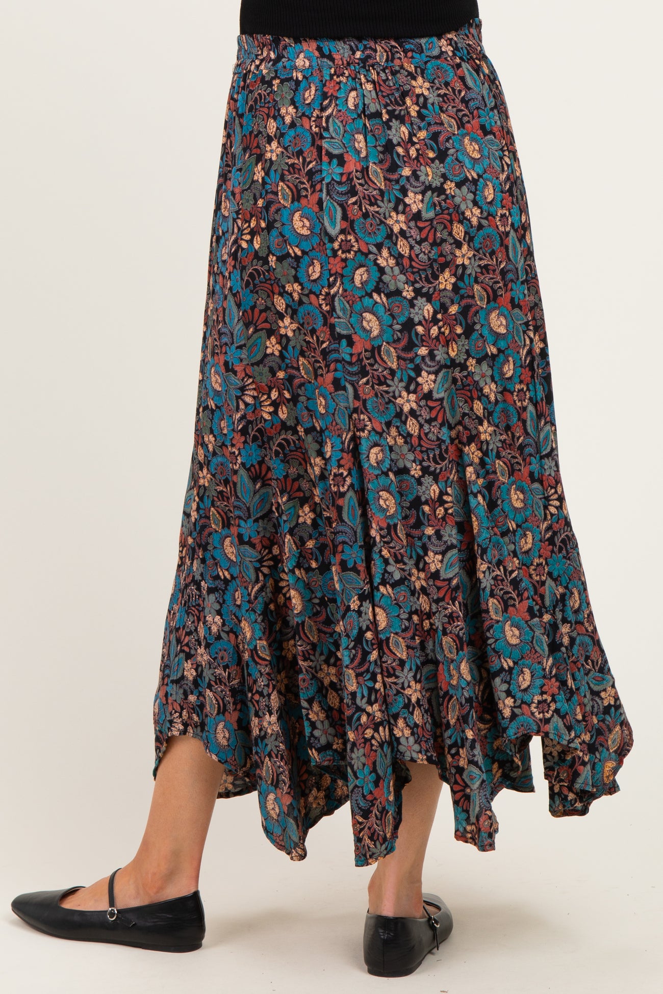 maternity wear floral print maxi skirt with a high-low hem and elastic waistband, model viewed from the back