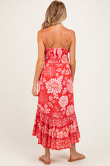 woman wearing a red floral maternity maxi dress with spaghetti straps and a ruffled hemline
