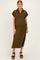 woman wearing a dark olive green short sleeve maternity dress with a collar and side slit