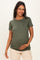woman wearing a dark green short sleeve maternity top and holding her baby bump