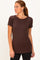 woman wearing a brown short sleeve t-shirt with a round neckline and a relaxed fit