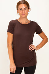 woman wearing a chocolate brown short sleeve t-shirt with a relaxed fit and round neckline
