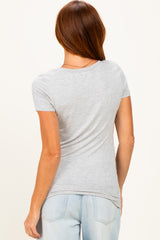 woman wearing a light gray short sleeve fitted t-shirt with a scoop neckline, shown from the back