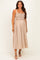 woman wearing a beige striped maternity dress with smocked bodice and adjustable straps, showcasing her baby bump