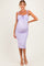 woman wearing a lavender maternity dress with tie straps and a fitted silhouette, showcasing her baby bump