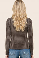 woman wearing a brown and cream striped long sleeve top with a fitted style, view from the back