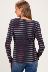 woman wearing a navy striped long sleeve maternity top viewed from the back