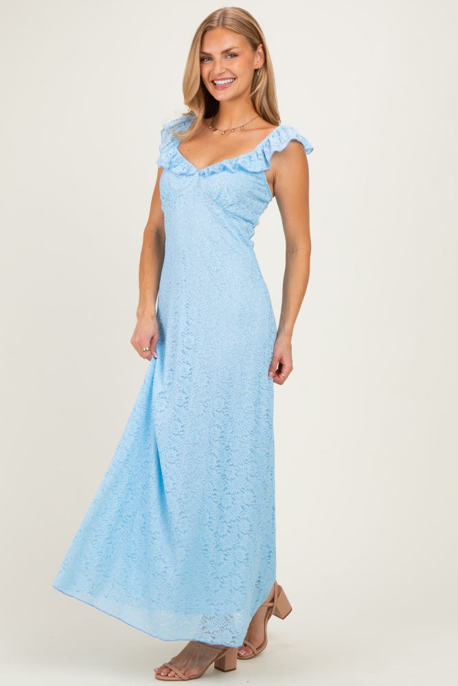 woman wearing a light blue lace maxi dress with ruffled straps and a v-neckline