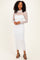 woman wearing a white lace long sleeve midi dress with a fitted silhouette and sheer details