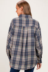 woman wearing a blue plaid maternity shirt with a relaxed fit, viewed from the back