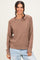 woman wearing a soft brown textured knit sweater with a relaxed fit and long sleeves