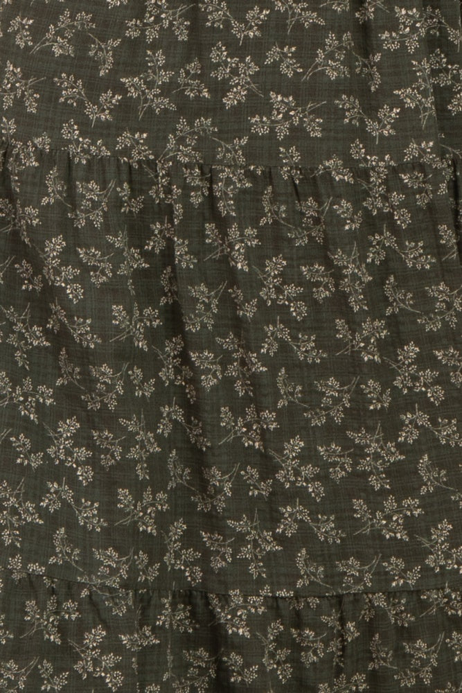 dark green floral tiered dress with subtle patterns and ruffled layers