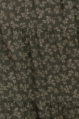 dark green floral tiered dress with subtle patterns and ruffled layers