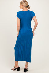 woman wearing a ribbed blue maternity maxi dress with short sleeves and a fitted silhouette