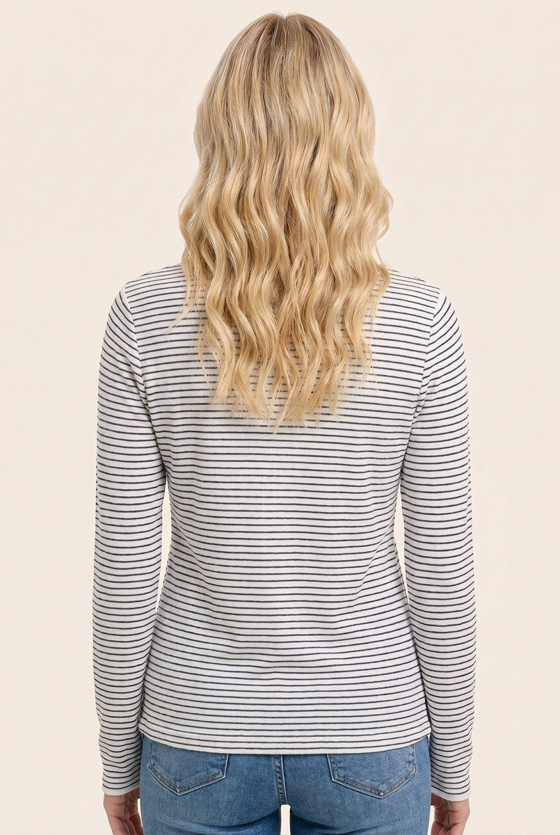 woman wearing a gray and white striped long sleeve top, viewed from the back