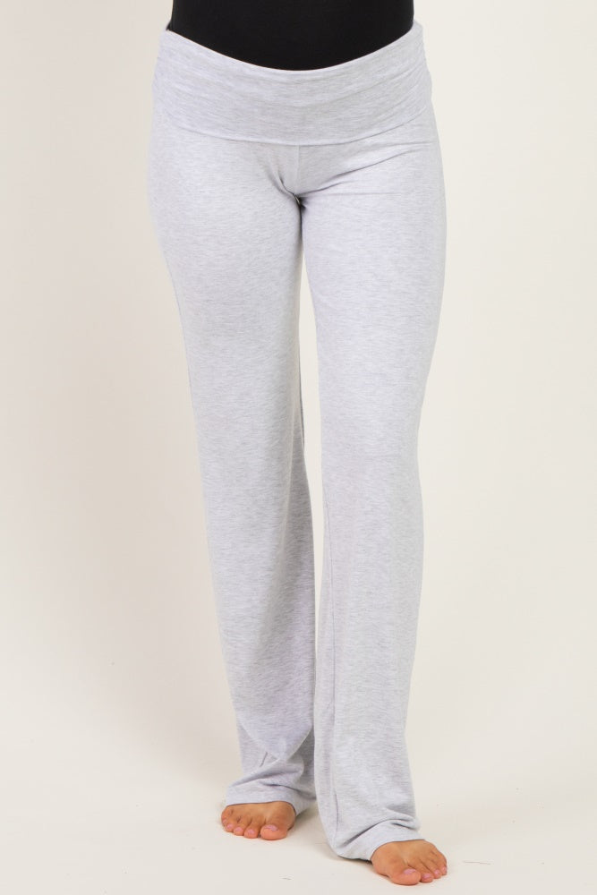 woman wearing gray maternity lounge pants with a wide waistband and a relaxed fit