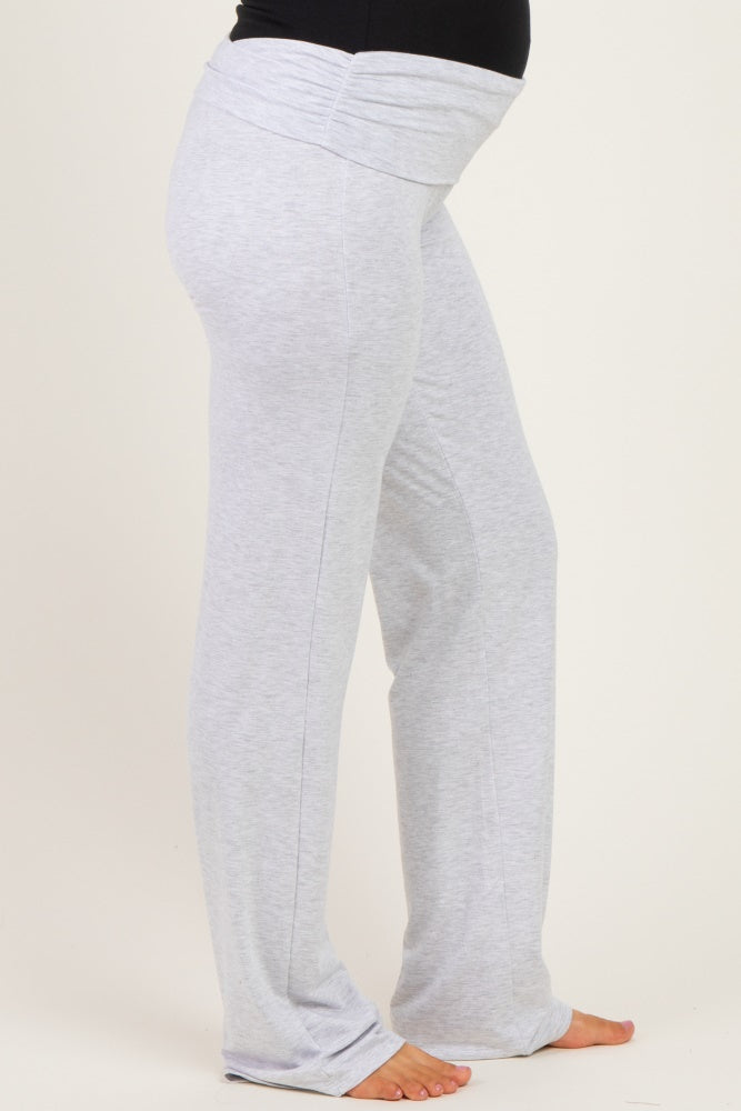 woman wearing light gray maternity pants with a foldover waistband