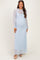 woman wearing a light blue lace maternity maxi dress with long sleeves and a visible baby bump