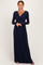 woman wearing a navy long sleeve maxi dress with a twisted bodice and a v-neckline