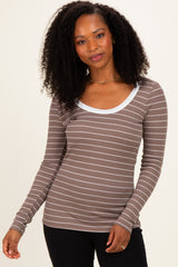 woman wearing a brown and cream striped long sleeve top with a scoop neckline and slim fit