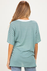 woman wearing a green striped maternity top with a white neckline, shown from the back