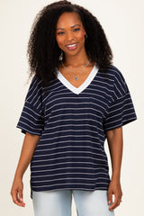 woman wearing a navy and white striped oversized t-shirt with a v-neck and pocket detail