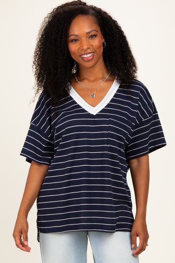 woman wearing a navy and white striped oversized t-shirt with a v-neck and pocket detail