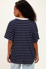 woman wearing a navy striped short sleeve top with a relaxed fit and side tie detail