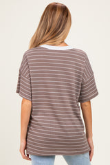 woman wearing a brown and white striped maternity top with a relaxed fit and short sleeves