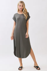 woman wearing a relaxed fit olive green t-shirt dress with short sleeves and side slits