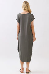 woman wearing a relaxed fit olive green maxi dress with short sleeves and side slits, viewed from the back