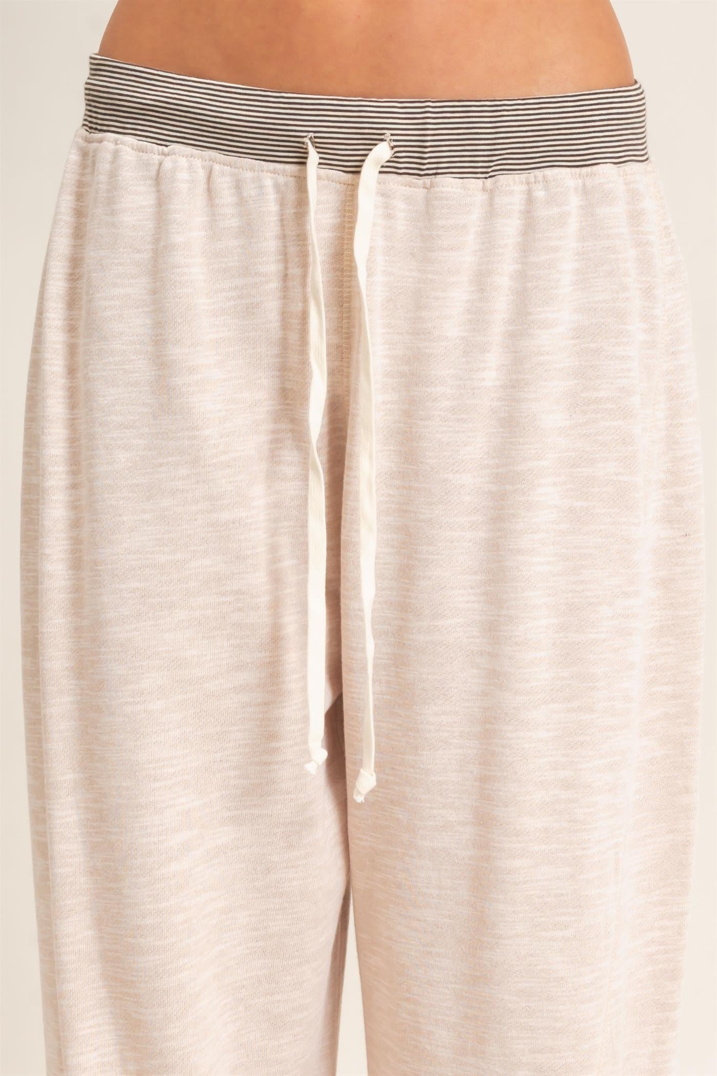 light beige drawstring lounge pants with a striped waistband