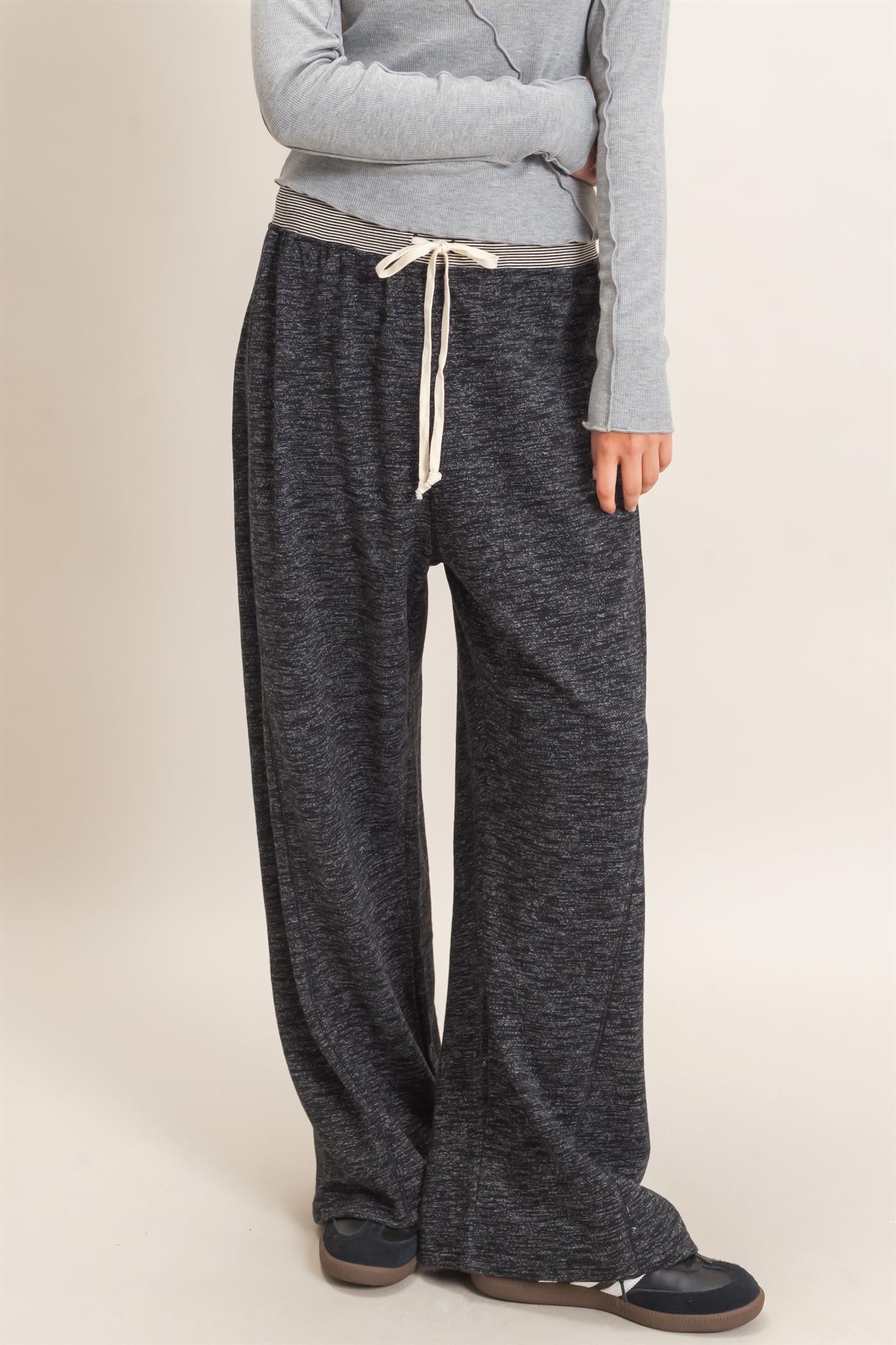 woman wearing gray marled wide-leg lounge pants with an elastic waistband and drawstring detail