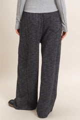 woman wearing gray marled wide-leg lounge pants, viewed from the back