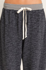 gray lounge pants with a drawstring waist and striped waistband detail