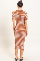 woman wearing a fitted short sleeve midi dress with orange and cream horizontal stripes, viewed from the back