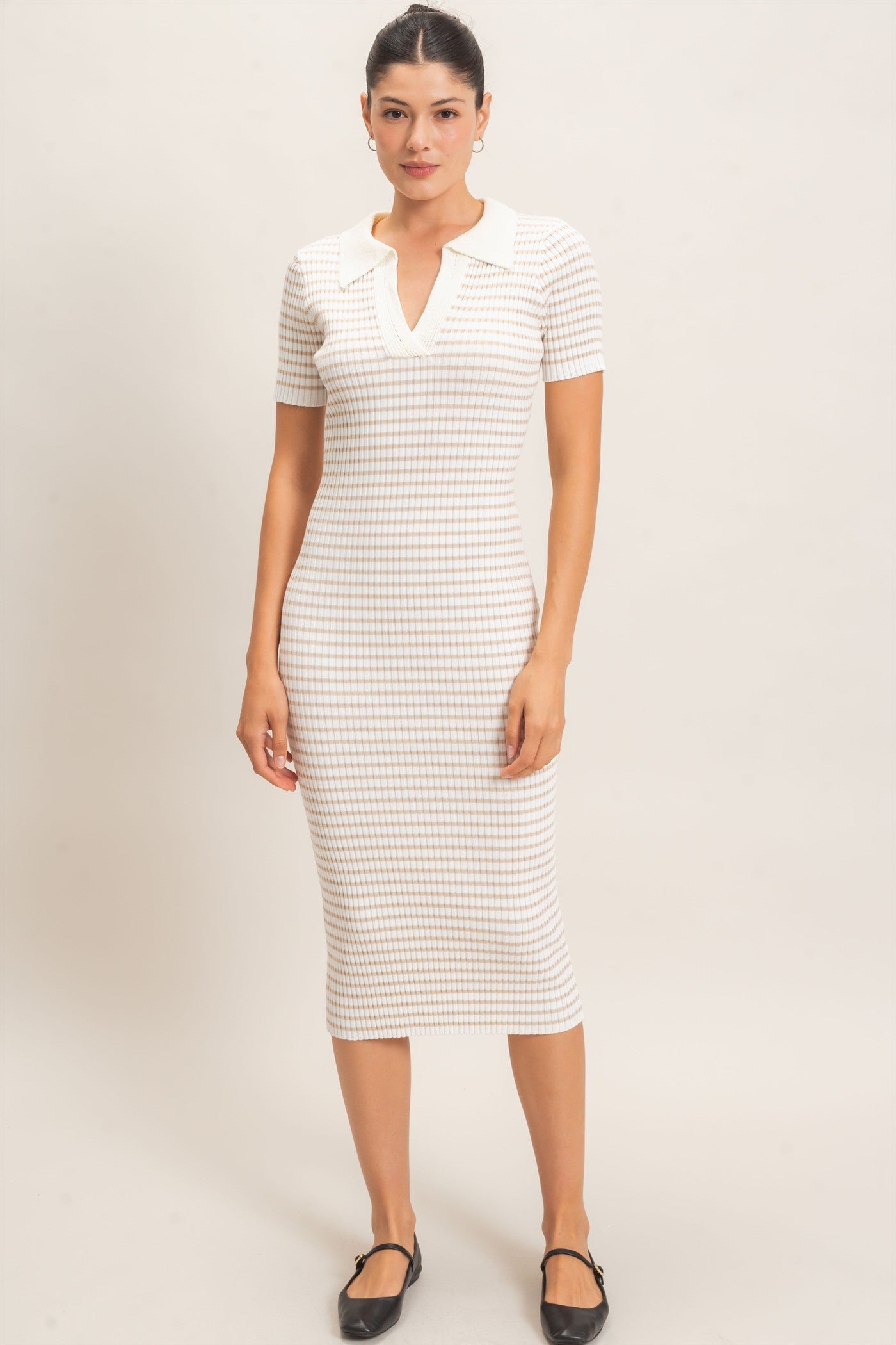 woman wearing a fitted white checkered midi dress with short sleeves and a collar